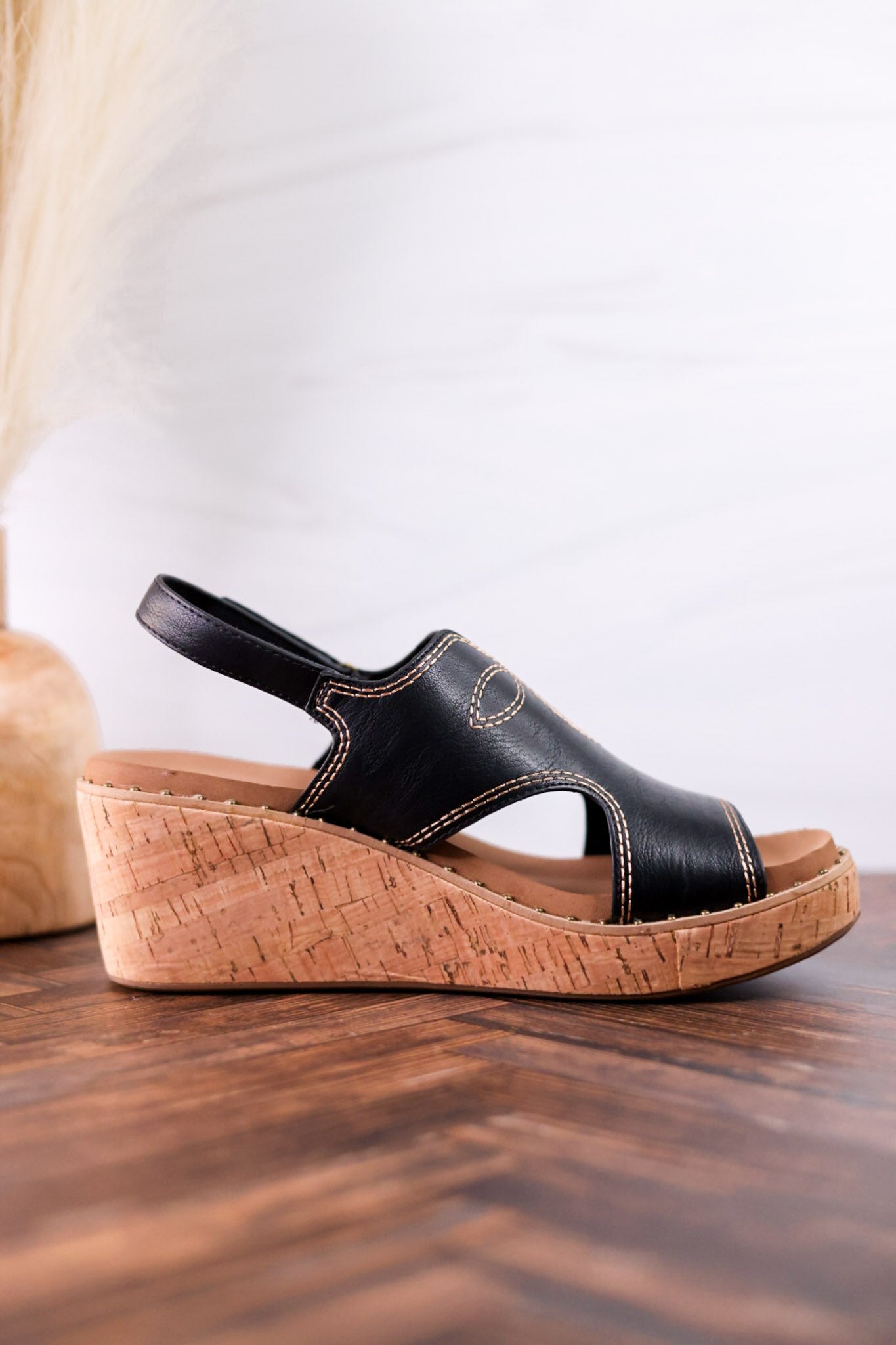Black Faux Leather Wedges With Stitching featuring open-toe design and cork wedge heel for stylish comfortable footwear