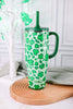 Lucky Leopard 40oz Mega Mug with green clover leaf pattern and dark green handle on wooden tray background