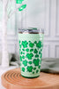 Lucky Leopard 24oz Party Cup with bright green clover and leopard print design and clear lid on wooden surface