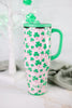 Clover Crush 40oz Mega Mug with bright green handle and shamrock pattern on a light pink background on marble surface