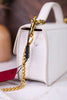 Close-up side view of Valencia Ostrich Leather White Bag focusing on gold chain and textured leather detail