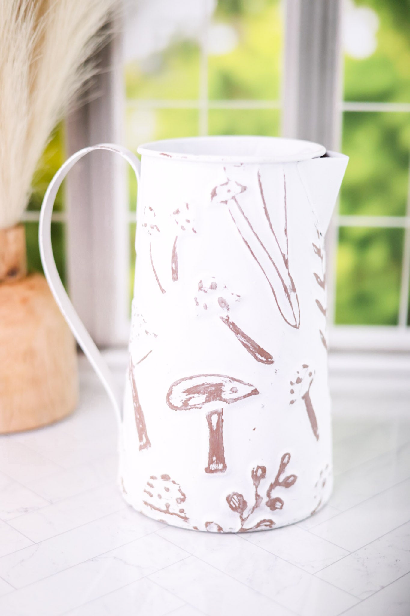 White Embossed Metal Pitcher with Mushroom Design