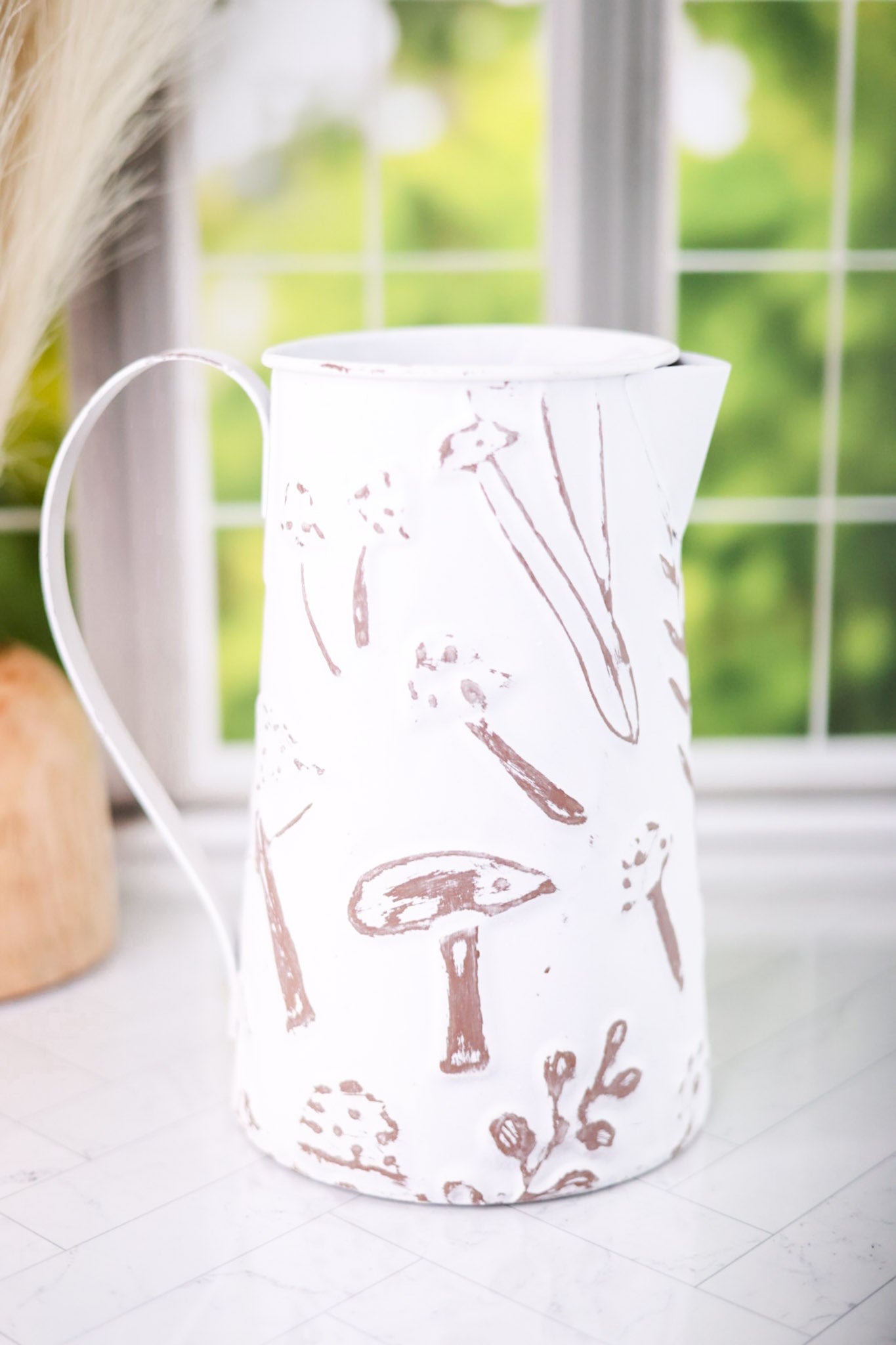 White Embossed Metal Pitcher with Mushroom Design