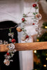 5ft Snowy Pine and Bells Garland - Whiskey Skies - MELROSE INTL