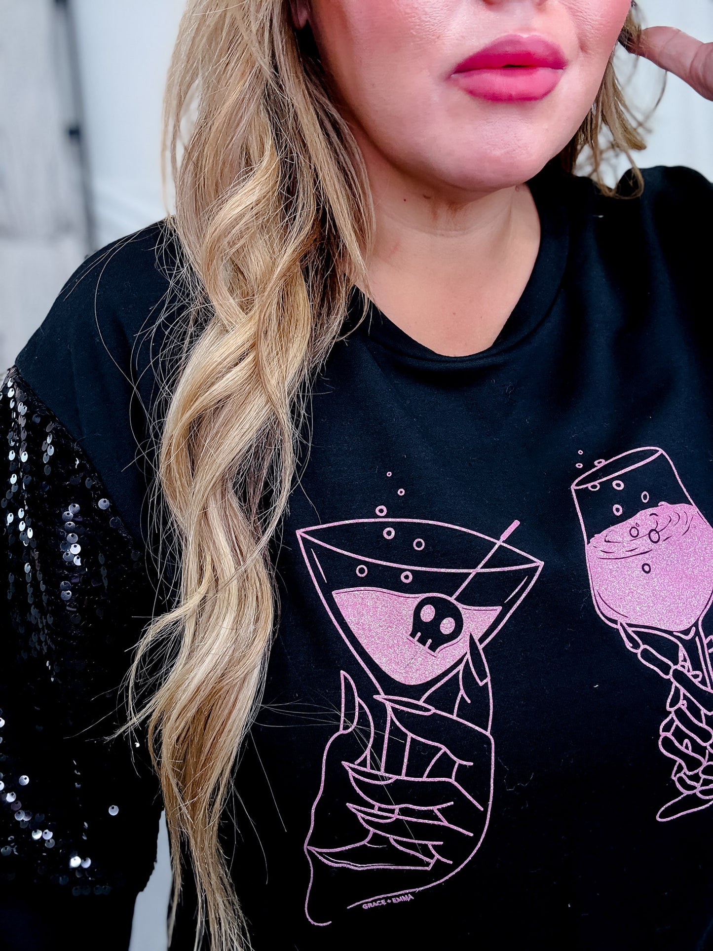 Long Sequin Sleeve Black Top W/ Poison Glasses Detail
