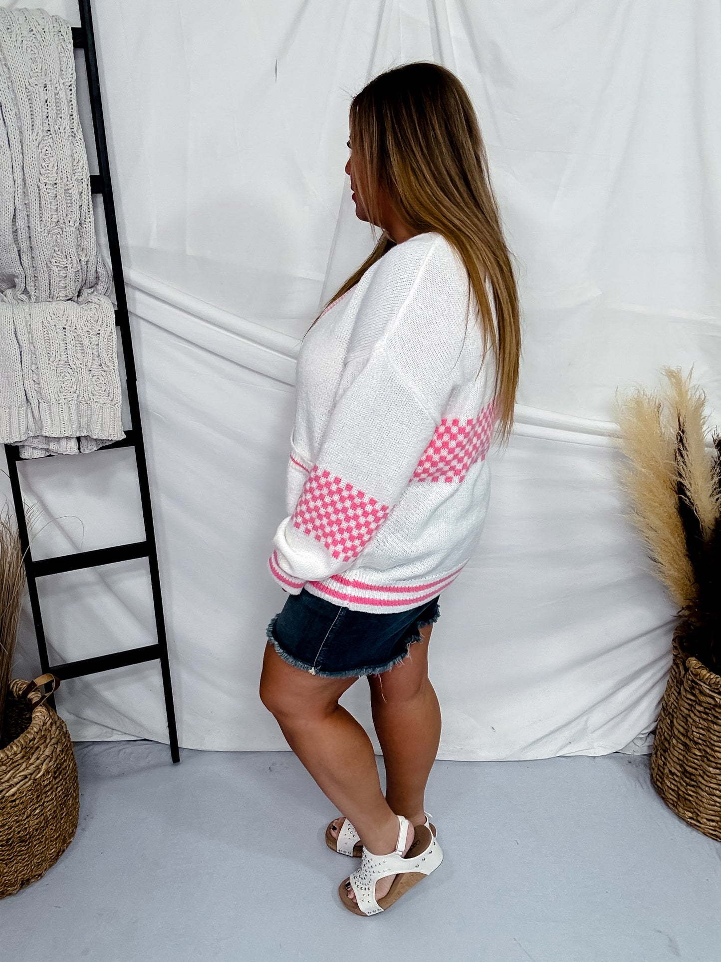 Lightweight Sweater Cardigan With A Pink And White Checkered Pattern