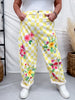 Yellow & White Checkerboard Barrel Leg Pants With Floral Print featuring colorful blooms and casual fit styled with white sneakers