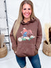 Woman modeling Western Bullrider Hoodie In Chocolate Brown with front graphic and stitched detail in casual indoor setting