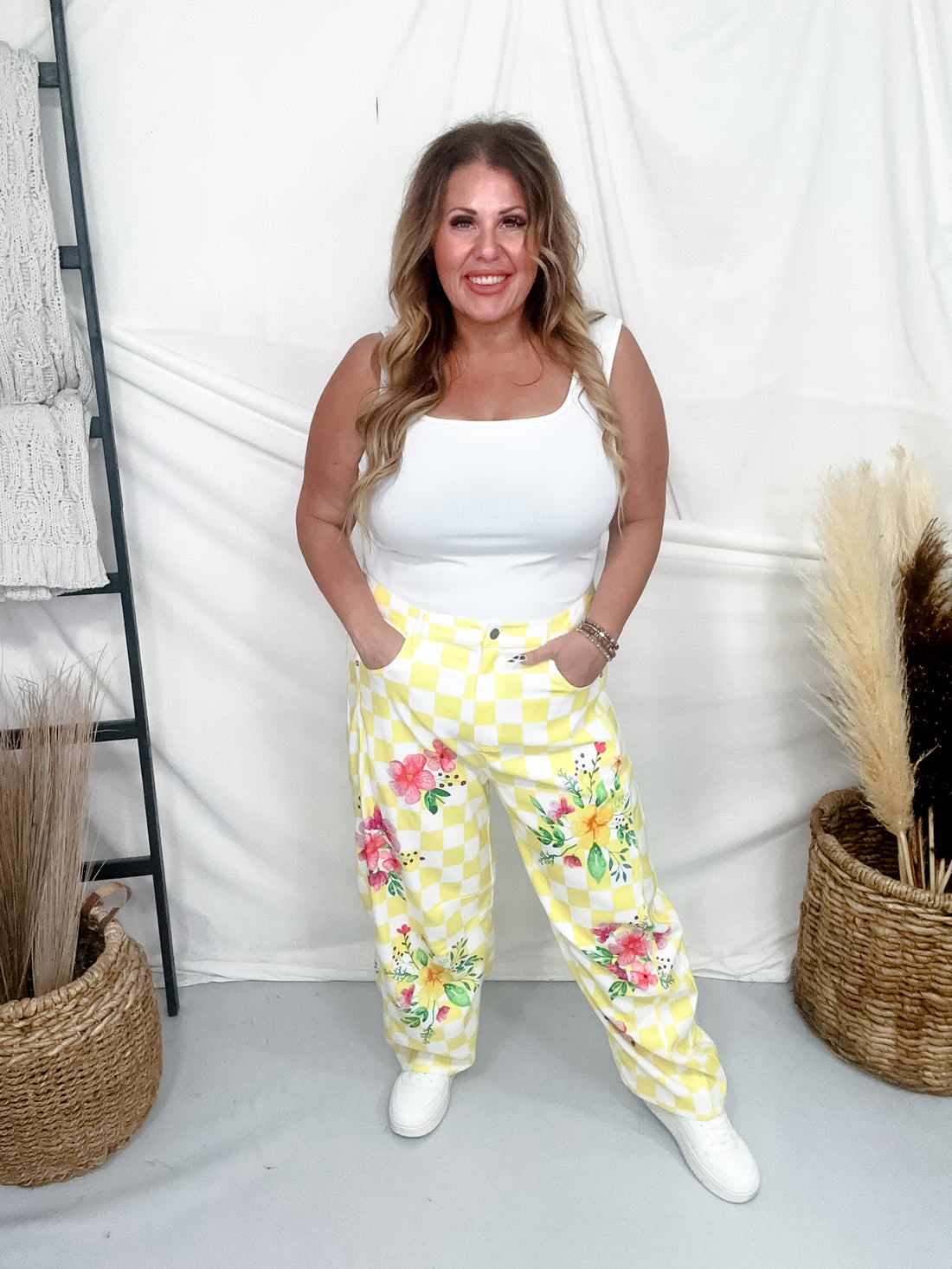 Yellow & White Checkerboard Barrel Leg Pants With Floral Print featuring vibrant flowers and relaxed fit on model against neutral backdrop