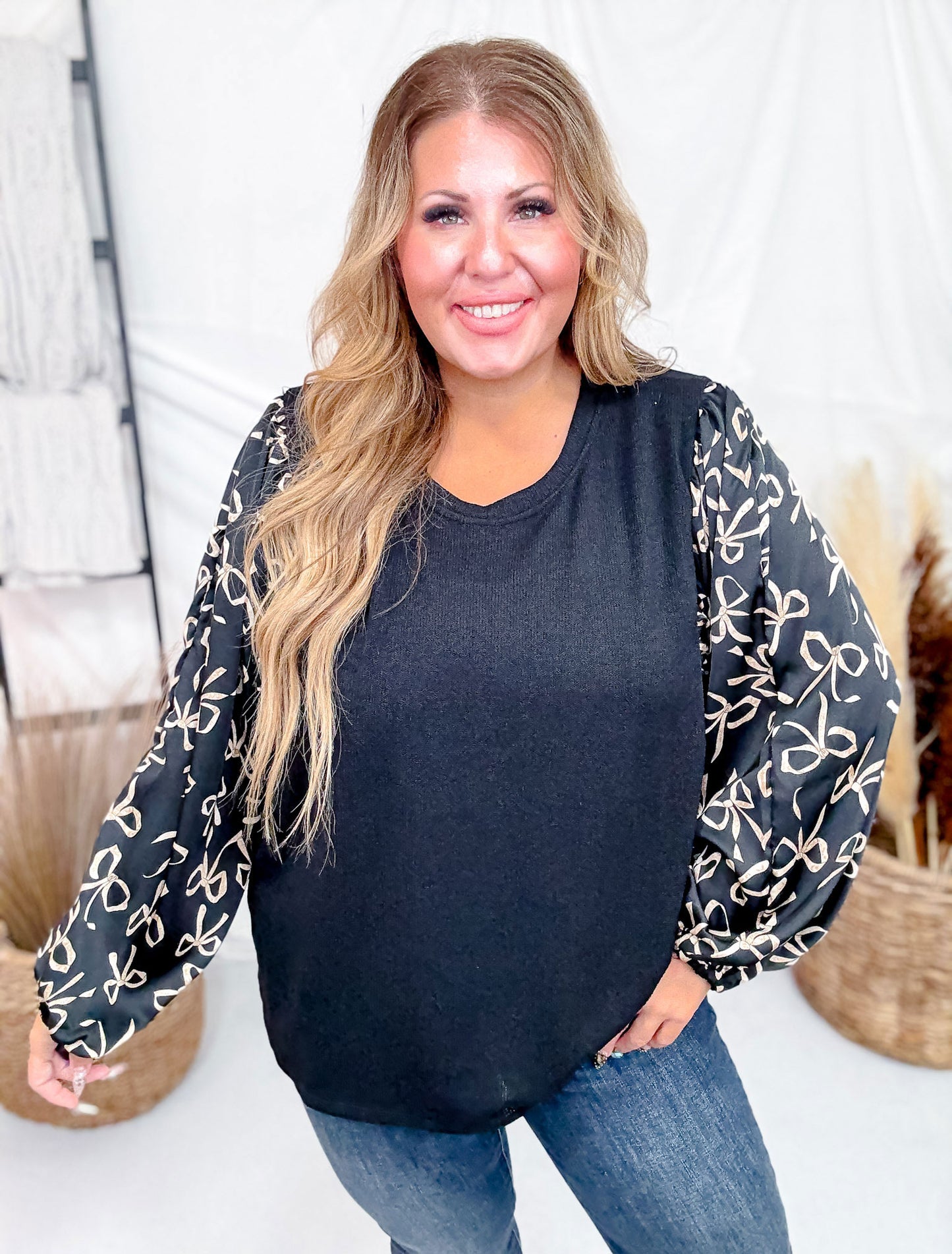 Black Knit Pullover Top With Bow Print Puff Sleeves