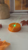 Orange LED Tea Light With Flashing Colorful Lights