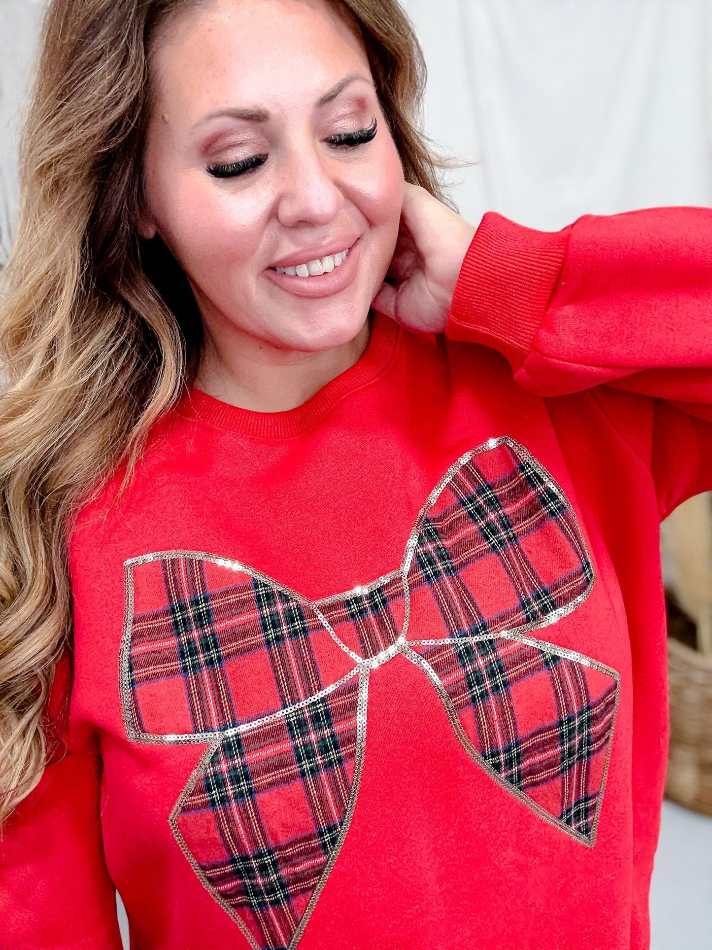 Red Sweatshirt With Plaid Christmas Bow - Whiskey Skies - SHE + SKY