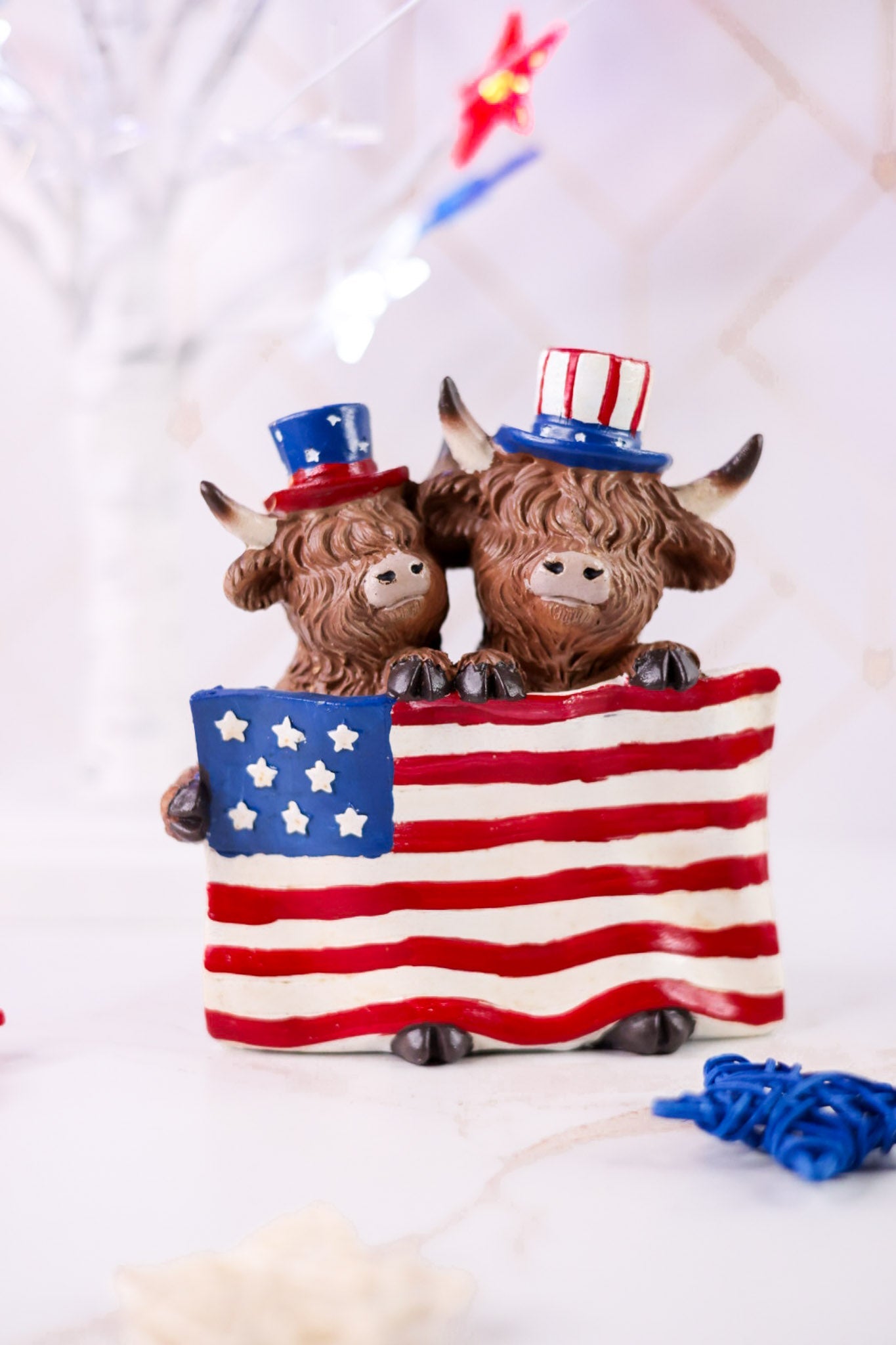 Resin Highland Cows Holding USA Flag - Whiskey Skies - GERSON COMPANIES