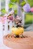 Resin Highland Cows In Easter Egg Carts (3 Styles) - Whiskey Skies - GERSON COMPANIES