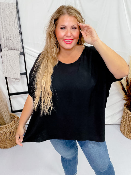 Short Sleeve Black Poncho Like Dolman Sleeve Top - Whiskey Skies - ANDREE BY UNIT